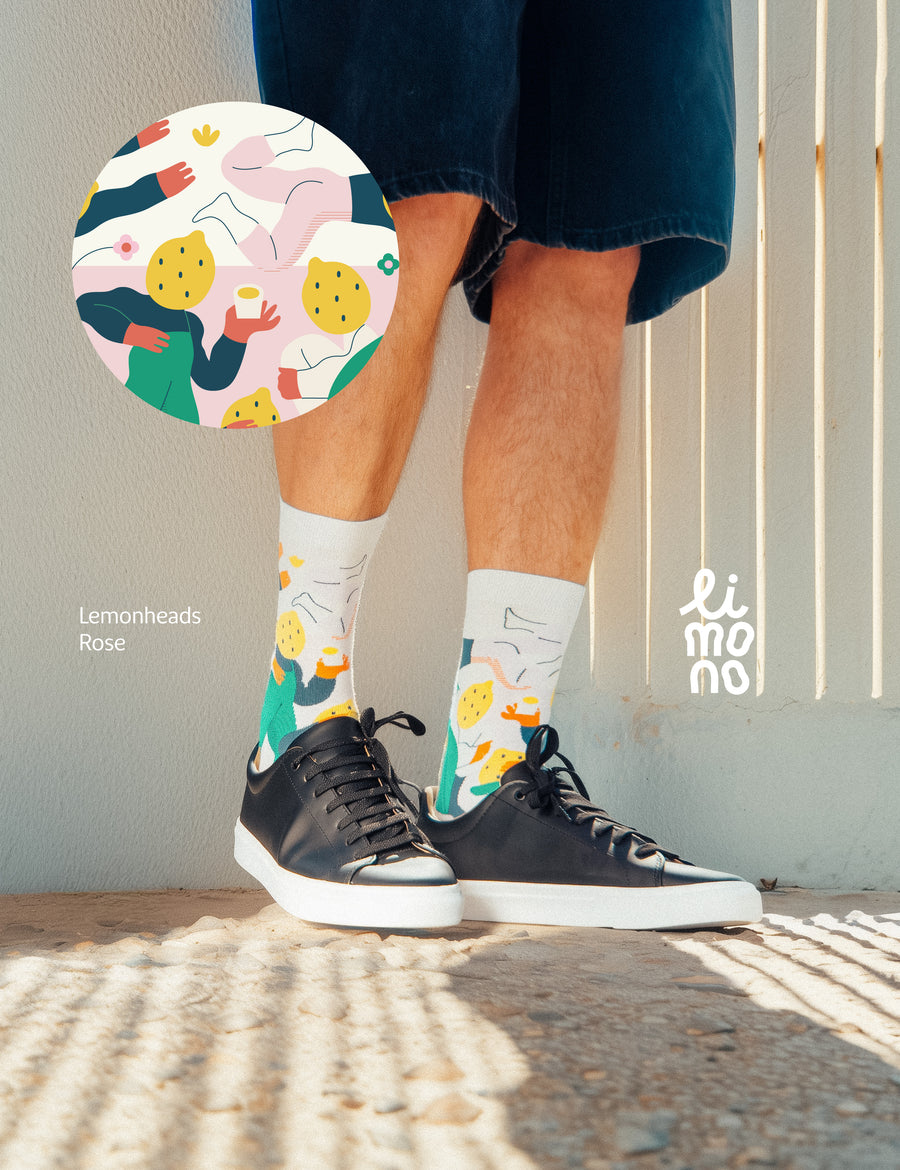 Cropped legs with black sneakers wearing Limono Lemonheads Rose socks with pattern overlay