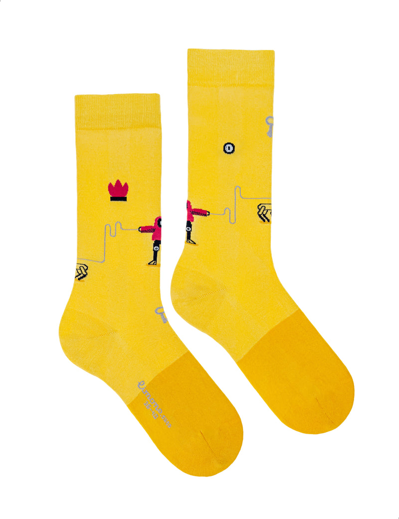 Limono Socks Robots Day collection. Illustrated socks on trend made in Portugal. Organic combed cotton. Yellow socks with black and red designs on a white background