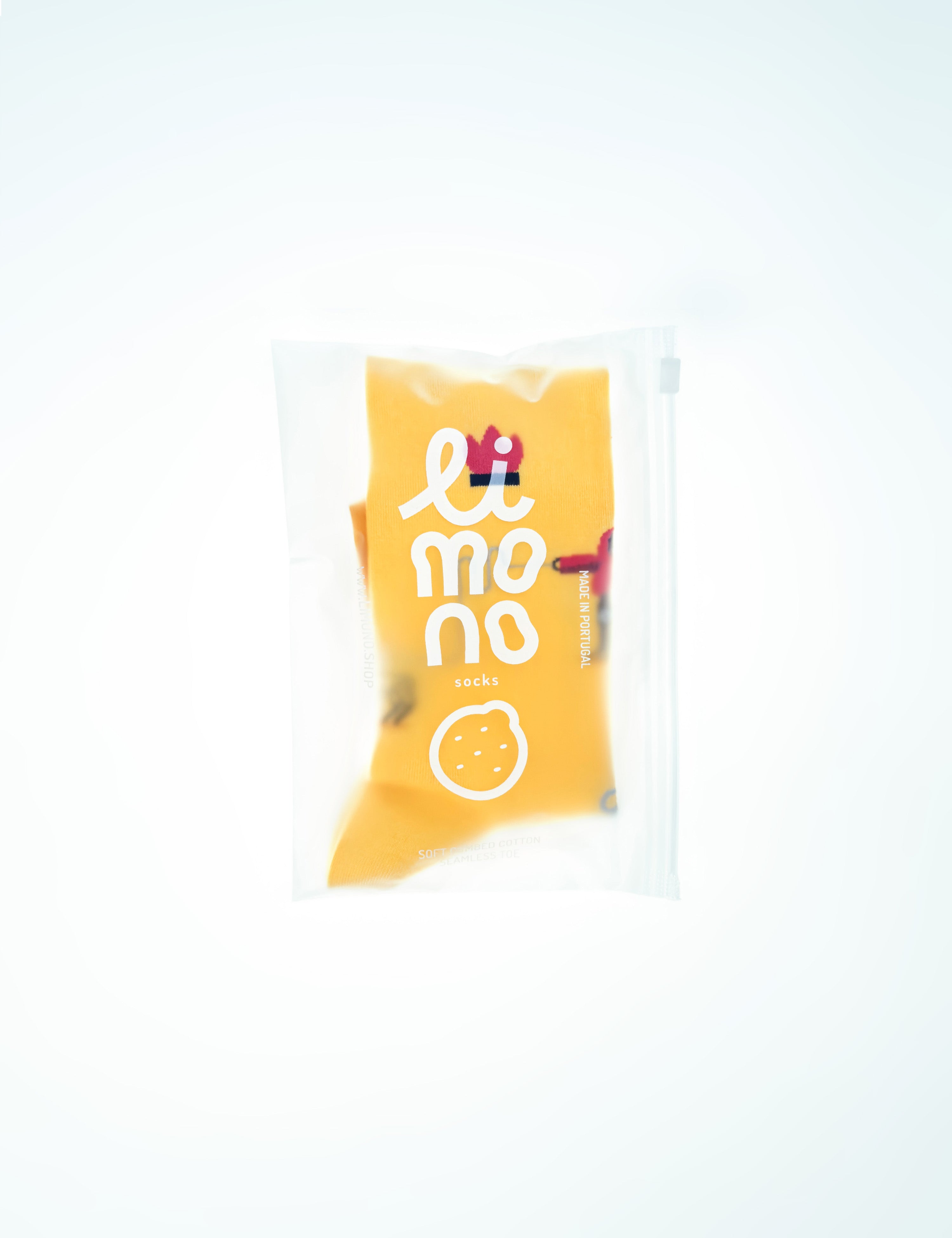 Limono Socks Robots Day collection. Illustrated socks on trend made in Portugal. Organic combed cotton. Yellow snack package with 'Lemon' branding on a white background