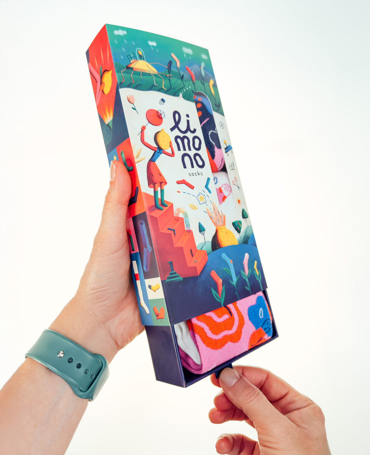 Hand holding open Limono illustrated gift box with Rain Clouds Magenta socks inside