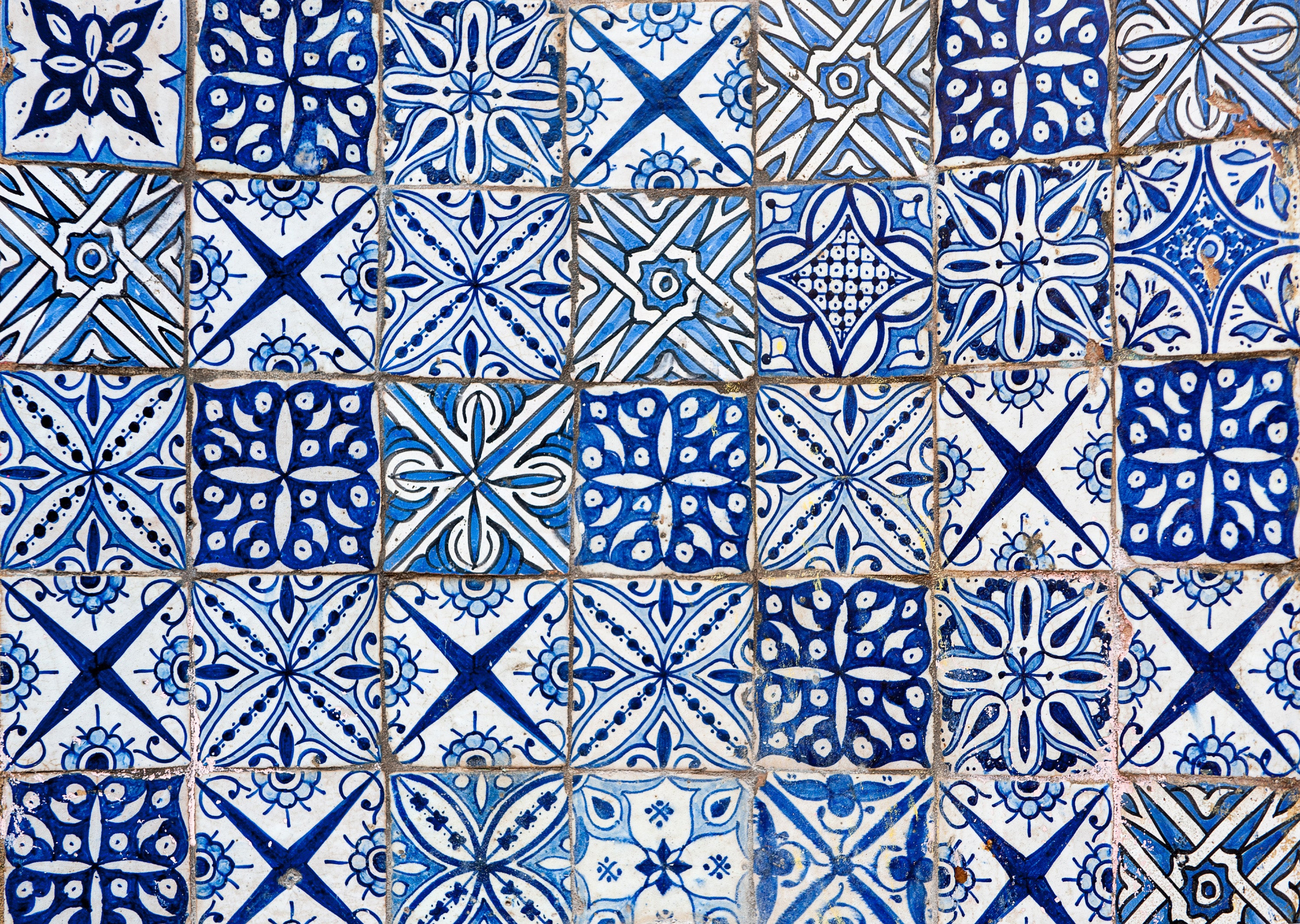 Blue and white Portuguese azulejos tiles with mixed geometric and floral patterns, Portugal