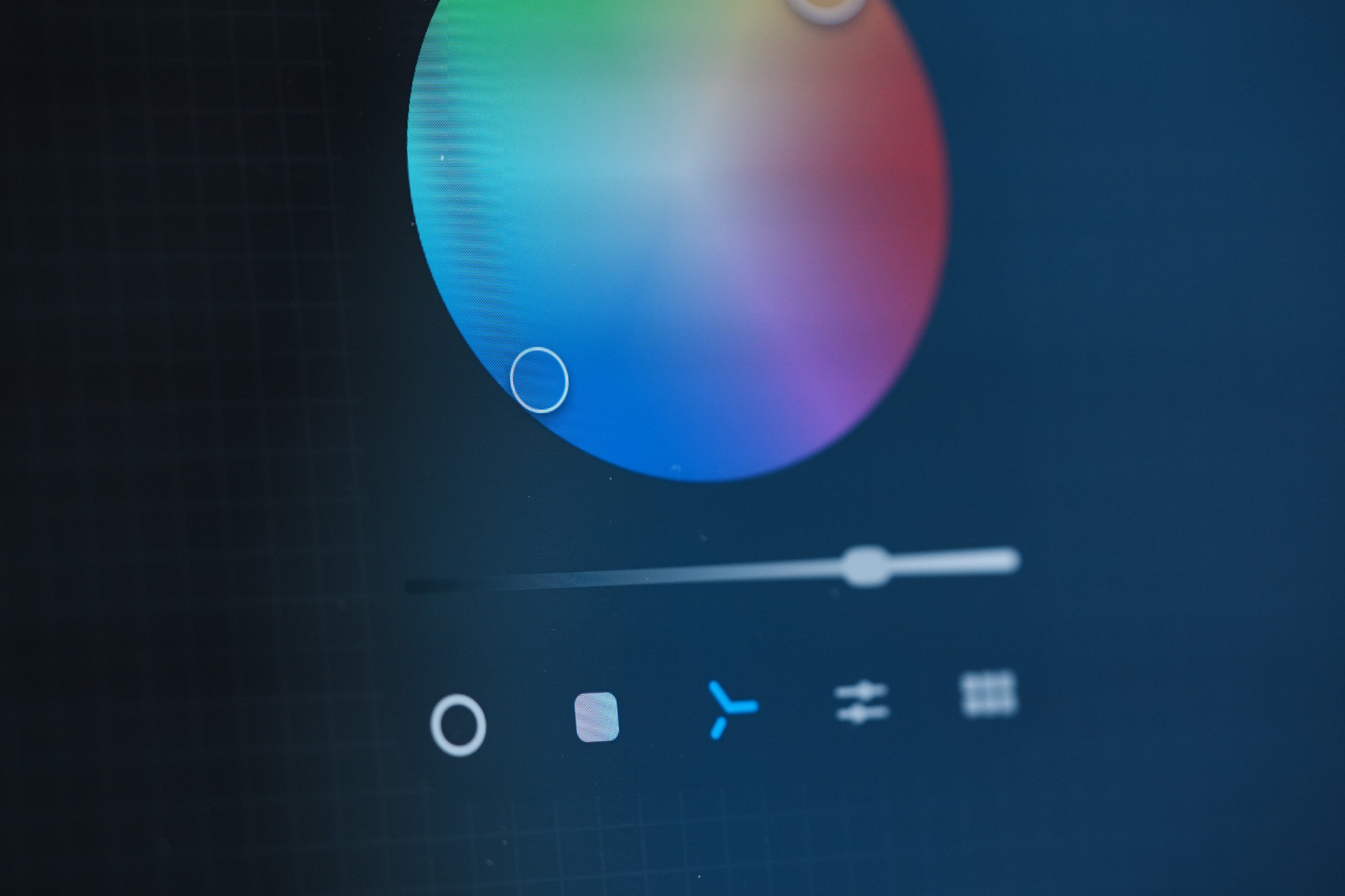 Close-up of digital color picker wheel on a tablet screen in Limono design studio