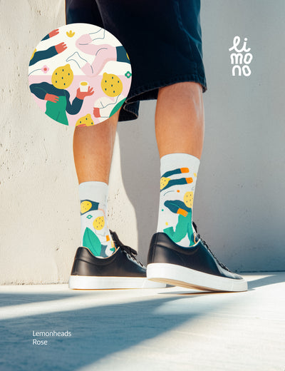 Cropped legs with black sneakers wearing Limono Lemonheads Rose socks with pattern overlay