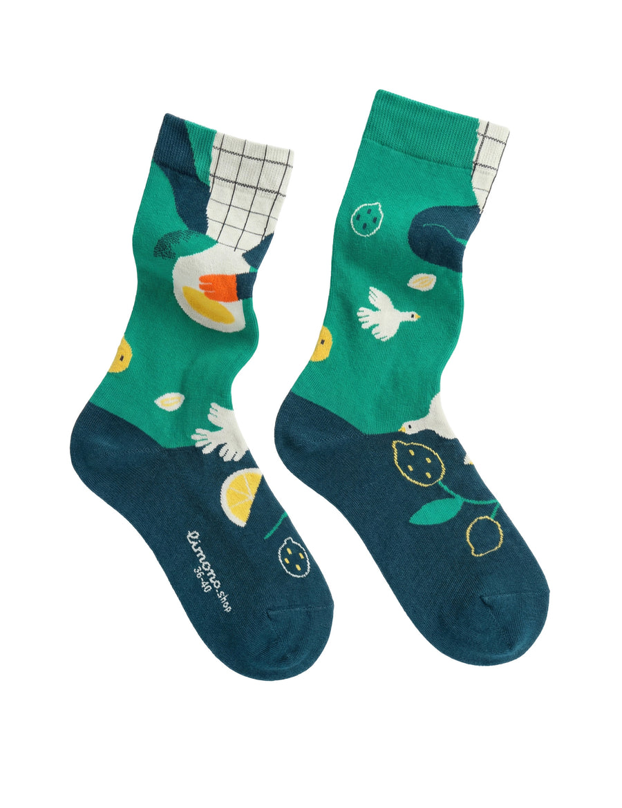 Limono Lemonheads Green socks studio pair with tea-cup-head character, bird and lemons