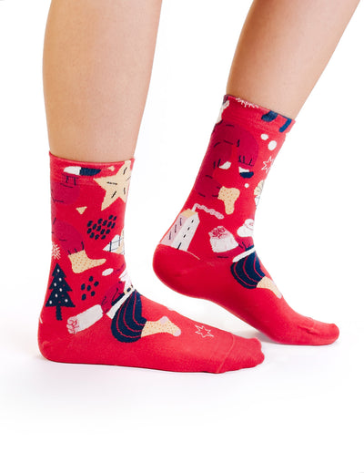 Limono Christmas Red socks with Santa, tree and gift box motifs worn on legs