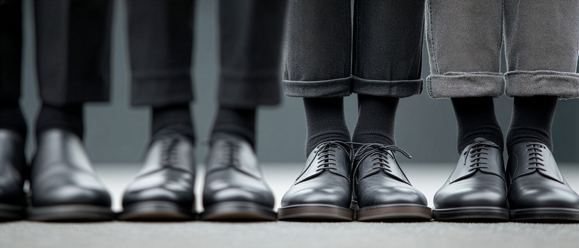 Limono manifesto editorial, four pairs in black trousers, black socks and dress shoes
